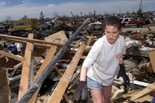 Amber Landis walks among the remains of her home in Moore, Oklahoma